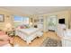 Comfortable main bedroom features an ensuite bathroom, ceiling fan, and beach decor at 167 N Cambridge Nw Dr, Port Charlotte, FL 33952