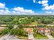 Aerial view of home with lush backyard and mature trees, in a desirable neighborhood at 1814 Pinyon Pine Dr, Sarasota, FL 34240