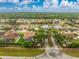 A high angle aerial view showing a well-planned community with mature trees and green spaces at 1814 Pinyon Pine Dr, Sarasota, FL 34240