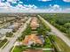 Aerial view of the home with a private pool in a lush backyard at 1814 Pinyon Pine Dr, Sarasota, FL 34240
