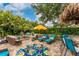 A backyard oasis with an outdoor seating area, fire pit, and tiki bar at 1814 Pinyon Pine Dr, Sarasota, FL 34240