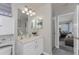 This bathroom has tiled floors, a vanity, and a shower with natural light at 1814 Pinyon Pine Dr, Sarasota, FL 34240