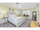Charming bedroom features neutral tones, coordinated furniture, and window views at 1814 Pinyon Pine Dr, Sarasota, FL 34240