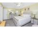Well-lit bedroom with decorative artwork, a cozy ceiling fan, and coordinated furniture at 1814 Pinyon Pine Dr, Sarasota, FL 34240