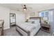 Inviting bedroom with large bed, ceiling fan, and ample closet space at 1814 Pinyon Pine Dr, Sarasota, FL 34240