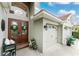 Charming home exterior featuring a double door entrance, two-car garage and well-maintained landscaping at 1814 Pinyon Pine Dr, Sarasota, FL 34240