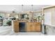 Kitchen featuring granite countertops, wood cabinets, stainless steel appliances and an open plan design at 1814 Pinyon Pine Dr, Sarasota, FL 34240