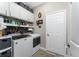 Organized laundry room featuring modern appliances, ample storage, and stylish decor at 1814 Pinyon Pine Dr, Sarasota, FL 34240