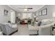 Comfortable living space featuring a desk, couch, ceiling fan, and natural light at 1814 Pinyon Pine Dr, Sarasota, FL 34240