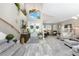 Bright living room boasts high ceilings, tile and carpet flooring, and elegant decor at 1814 Pinyon Pine Dr, Sarasota, FL 34240