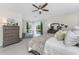 Bright main bedroom with soft carpet and elegant decor, overlooking the pool area at 1814 Pinyon Pine Dr, Sarasota, FL 34240