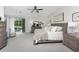 Spacious main bedroom offers natural lighting and an elegant view of the pool area at 1814 Pinyon Pine Dr, Sarasota, FL 34240