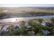 Aerial view of a lovely home and neighborhood, close to the water and near an airport at 1851 Scenic Dr, Venice, FL 34293