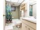 Bathroom featuring tile and tub with shower at 1851 Scenic Dr, Venice, FL 34293
