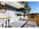 Charming outdoor deck with seating area, offering a relaxing space for enjoying the outdoors and views at 1851 Scenic Dr, Venice, FL 34293