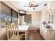 Bright dining area with a TV, large windows, and modern furnishings at 1851 Scenic Dr, Venice, FL 34293