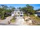 Exterior aerial front of a home with a driveway and minimalist yard at 1851 Scenic Dr, Venice, FL 34293