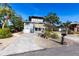 Exterior of the home with a driveway and front yard with minimalist plants at 1851 Scenic Dr, Venice, FL 34293