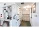 Bright kitchen with white cabinets, appliances, and ample counter space at 1851 Scenic Dr, Venice, FL 34293
