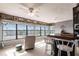 Bright living space with ample natural light, featuring waterfront views, a bar, and nautical decor at 1851 Scenic Dr, Venice, FL 34293
