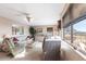 Comfortable living area with large windows offering views, plush seating, and a warm, inviting atmosphere at 1851 Scenic Dr, Venice, FL 34293