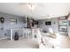 Cozy sunroom with comfortable seating, a built-in bar, nautical accents, and bright views of the outside at 1851 Scenic Dr, Venice, FL 34293