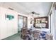 Open sunroom featuring sliding glass doors that provide seamless indoor-outdoor living at 1851 Scenic Dr, Venice, FL 34293