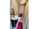 Bathroom with toilet, sink vanity, vanity mirror, and black accent seat at 190 Danforth Dr, Punta Gorda, FL 33980