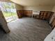 Bedroom featuring new floors, a glass sliding door with a view of the exterior, and walls ready for customization at 190 Danforth Dr, Punta Gorda, FL 33980