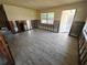 Unfinished living room space showing tile flooring, block walls, and exposed framework awaiting renovation at 190 Danforth Dr, Punta Gorda, FL 33980