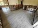 Renovated living room showcasing new tile flooring and exposed wall framework at 190 Danforth Dr, Punta Gorda, FL 33980