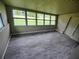 Sunroom with new floors and many windows that offer a nice view of the yard at 190 Danforth Dr, Punta Gorda, FL 33980