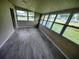 Sunroom with lots of windows overlooking the exterior and new floors at 190 Danforth Dr, Punta Gorda, FL 33980