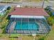 Aerial shot of a home with a screened pool, showcasing the property's layout and location at 21169 Edgewater Dr, Port Charlotte, FL 33952