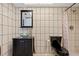 Tiled bathroom featuring a modern vessel sink and walk-in shower at 21169 Edgewater Dr, Port Charlotte, FL 33952