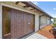 Close-up of the inviting front door showcasing its unique design and character at 21169 Edgewater Dr, Port Charlotte, FL 33952
