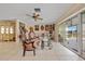 Cozy living space with tiled floors, comfortable seating, and sliding glass doors at 21169 Edgewater Dr, Port Charlotte, FL 33952