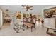 Open living room with tiled floors, eclectic seating, and partial kitchen view at 21169 Edgewater Dr, Port Charlotte, FL 33952