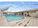 Inviting screened pool area, ideal for entertaining and enjoying the outdoors at 21169 Edgewater Dr, Port Charlotte, FL 33952