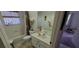 Functional bathroom featuring a tub-shower combo and a single sink vanity with essential toiletries at 21342 Walling Ct, Port Charlotte, FL 33954