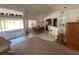 Open-concept dining area with large windows and a view to a lanai at 21342 Walling Ct, Port Charlotte, FL 33954
