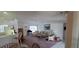 Bright and airy living space featuring a breakfast bar connecting to a dining area, perfect for entertaining at 21342 Walling Ct, Port Charlotte, FL 33954