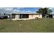 View of backyard with covered back porch at 22191 Augusta Ave, Port Charlotte, FL 33952