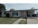 Charming single-story home features a welcoming entryway and covered parking at 22191 Augusta Ave, Port Charlotte, FL 33952