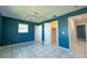 Bedroom with tile floors and an open closet and bathroom at 2230 Harbor Blvd, Port Charlotte, FL 33952