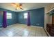Bedroom with tile floors, two windows, and a ceiling fan at 2230 Harbor Blvd, Port Charlotte, FL 33952