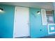 Close-up of the front door with the house number and a white door at 2230 Harbor Blvd, Port Charlotte, FL 33952