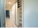 Hallway features sliding closet doors for efficient storage and easy access to belongings at 2230 Harbor Blvd, Port Charlotte, FL 33952