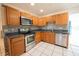 A kitchen with modern appliances and a stylish backsplash at 2230 Harbor Blvd, Port Charlotte, FL 33952