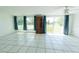 Spacious living room with tile flooring and ample natural light from windows at 2230 Harbor Blvd, Port Charlotte, FL 33952